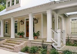 Situated under magnificent oak trees, this river front cottage showcases  classic features with an inviting air of timeless warmth. Designed by Bob  Chatham Custom Home Design Built by Rick Twilley of Twilley