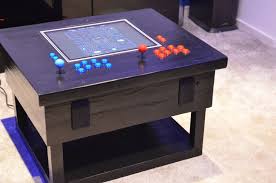 I made this wood grain themed nes controller coffee table out of 1 piece of 3/4 plywood, some 1/4 plywood and a few scraps of red oak for legs and handles. Tech Infused Arcade Coffee Table Made Out Of Scrap Wood