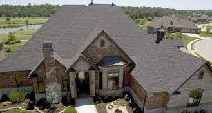 Expert advice on repairing and replacing wood roof shingles, locating leaks, repairing and replacing damaged shingles and removing moss from wood shingle roofing. Heritage Premium Laminated Asphalt Shingles Brick Exterior House House Exterior Roof Restoration