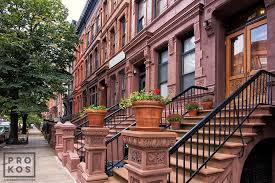 A cleverly conceived hybrid townhouse — the pale front is a historically correct brownstone and the back a bold architectural grid of glass and steel — on a classic upper west side block near the american museum of natural history is poised to enter the market at $12 million. Harlem Brownstones Ii Framed Photograph By Andrew Prokos