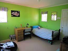 A Simple 12 Year Old Boys Bedroom With Blue Striped Bed And Wooden Cabinet Also A Bean Bag In Green Colored Bedroom Colors Bedroom Design Kids Bedroom Designs