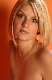 Blond Woman Wearing Yellow Top Stock Photo