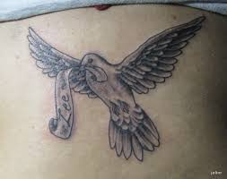 This image of a dove is a great neck tattoo because it's dark and colorful. Dove Tattoos Designs Ideas Meanings And Pictures Tatring