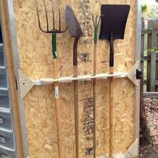 Huge selection of garden storage buildings at factory direct pricing. Shed Door Doubles As Shovel Storage Small Garden Tools Garden Tool Rack Diy Garage Storage