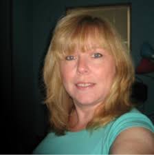 Sandy Morse stands next to our CEO, Greg Burns, as we celebrate her 25th  work anniversary.