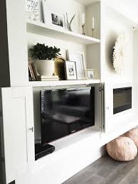 5 ways to make your tv less conspicuos rc willey blog living room built ins built in shelves living room family room design