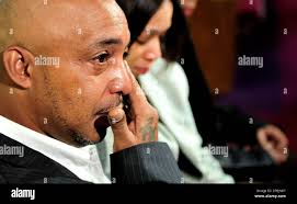 Maersk Alabama crew member William Rios wipes a tear from his eye as he  sits with his wife Sherry at the Second St. John Baptist Church, Sunday,  April 19, 2009 in the