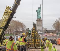 La liberté éclairant le monde) is a colossal neoclassical sculpture on liberty island in new york harbor within new york city. Statue Of Liberty S Original Torch Completes Move To New Home U S National Park Service