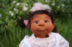 The girl for whom I made the doll is named Hanna. Just like its owner, the  doll has warm honey eyes. Her eyes are large and alert, delicate and full  of nostalgia.