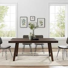 Constructed with dark oak brown stained wood includes pop up leaf extension to expand table legs are handcrafted country inspired design easily seats 4 to 6 chairs suitable for dining room minor assembly required, tools and instructions included *note: Dark Oak Wood Rustic Dining Table Kirklands