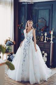 A Beautiful White Gown With A Touch Of Something Blue Cass Wedding Is Presenting The Perfect Fusion Of Romance And Elegance Wedding Dresses Whimsical Enchanted Wedding Dress Wedding Dresses Unique