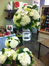 Now this is a slightly different flower posting. Stunning White Floral Arrangements With White Orchids For A 50th Anniversary Party Anniversary Centerpieces 50th Wedding Anniversary 50th Anniversary Party