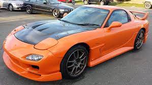 Although discontinued in 2002, you can still see this sleek auto on the streets and in people's garages. Saving Up To Import This Rocket 1997 Mazda Rx7 Twin Turbo Mazda Rx7 Rx7 Japan Cars