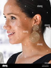 Head shot gold earrings hi-res stock photography and images