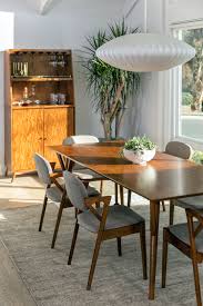 If you've ever attempted to purchase cookware for a new kitchen or simply tried to improve the quality of tools in your current kitchen you've probably found that stocking up on high quality kitchen. Give Your Kitchen Decor A Mid Century Feel With Luxury Furniture Mid Century Dining Table Mid Century Dining Room Tables Mid Century Dining Room