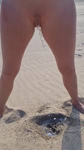 Peeing 1: Nice standing beach pee into a small… ThisVid.com