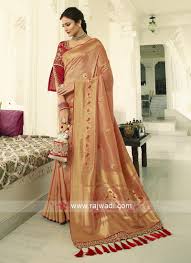 Contrast colour for peach pink. Peach Banasari Silk Saree With Contrast Unstiched Blouse