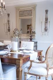 French gray square back dining chairs surround a dark brown trestle dining table placed on a black and ivory print rug and lit by a restoration hardware vitti. From Old School To Modern The Evolution Of A French Country Dining Room