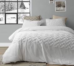 A square decorative pillow with metallic embroidery makes statement on top of the bed, while an oblong pillow with fabric manipulation provides a charming finishing touch. Super Soft White Cotton Twin Xl Bedding To Fit Twin Or Twin Xl Bed With Stylish Textured Design Pattern