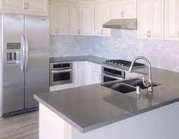 Modern white kitchen cabinets with grey countertops. Pin On Future Home Decor