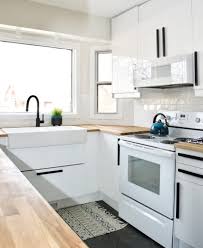 White quartz countertops are somewhat in balance with gray rustic cabinets and wood floors. Before After Kitchen Renovation Interior Design Real Estate Staging