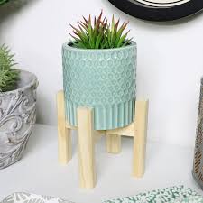 If you are looking to decorate your own home or want to help your friend decorate their house with. Green Planter With Wooden Stand