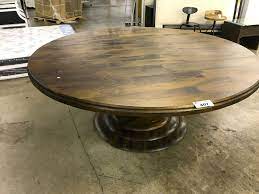 The cherry finish is highlighted by gold tipping that accentuates the traditional feel of the dining table. Magnolia 76 Round Walnut Dining Room Table