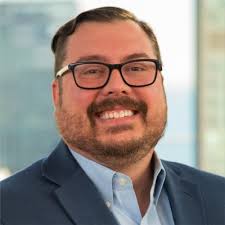 Here's a photo of me giving an inspiring and actionable speech to some VPs  at a HUGE company. I signed a bunch of NDAs, otherwise I would tell you  what the company