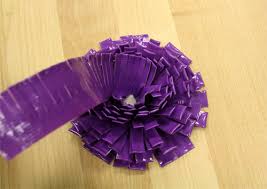 Cut petals on the duct tape strip and wrap it around a bud. How To Make Duct Tape Flowers
