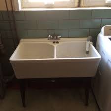 The sink is ceramic, and the cabinet is white to match its tone, so the whole piece the golden colour of cranes adds a nice accent. Cast Iron Laundry Sink Crane Cast Iron Laundry Sink Laundry Sink Sink