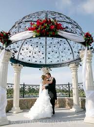 Pergolas incorporate beauty and function to your front or backyard. Gazebo Decoration Option This Is A Nice Idea To Soften The Pillars And Add Color With Flowers Gazebo Wedding Gazebo Wedding Decorations Gazebo Decorations