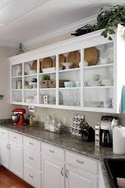 Like this beautiful arlington heights kitchen renovation that features glass door cabinets and open shelving in addition to regular kitchen cabinetry, whether or not upper kitchen tip: How To Style Your Open Kitchen Shelving