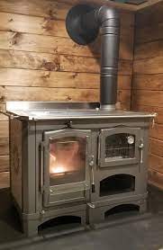 When you're finished, clean out the firebox. Regina Wood Cook Stove