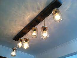 The lamps hang from a rustic wood fixture in keeping with farmhouse style. Modern Farmhouse Track Lighting Novocom Top