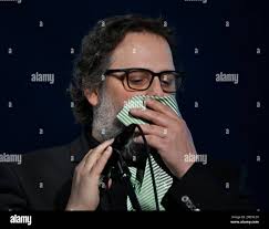 Quebec, Canada. 17th July, 2023. Les Cowboys Fringants lead singer Karl  Tremblay coughs into his tie as he sings during their performance at the  Quebec Summer Festival, in Quebec City, Monday, July