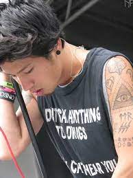 There's a sun on the top of his right arm with the letters mskmth tatted on the bottom of it. Taka One Ok Rock Selebritas