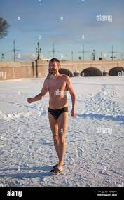 Russian naked male standing on ice in Epiphany frosts on January 19, 2013  in Saint-Petersburg, Russia. Neva river Stock Photo - Alamy