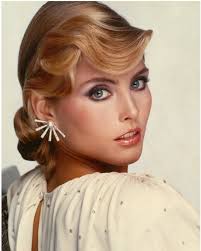 This photo has a very “Old Hollywood” style and feel to it. You can only  imagine the amount of hairspray that the stylist used to make my hair stay  like that!