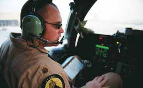 Capt. Eric Cleveringa, deployed from the Air National Guard's 114th Fighter  Wing, Joe Foss Field, Sioux Falls, S.D., signals t