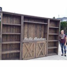 Ideal for a modern farmhouse living room with a stylish mix of open and concealed spaces; Pin By Janna Taylor On Rustic Chic Pallet Entertainment Centers Farm House Living Room Rustic Entertainment Center