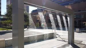 The water curtain is an impressive indoor decorative fountain idea for offices or large shopping centres. Digital Water Curtain At Houston Center Codaworx