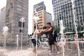 Mom and kids at beach stock video. Kids Playing With Water On Their Summer Holiday By Goody Satondee Photo Stock Snapwire