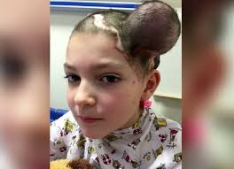 Bouncy curls provide body and the thin braid wrapped around the ponytail holder is a delicate detail. 41 Haircut For A 13 Year Old Boy