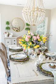 Handfuls of candy eggs and paper grass—placed just so—look like a bird's nest when perched atop each guest's plate. Easter Bunny Spring Table Setting