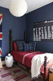 This girly and colorful kids bedroom features a butterfly accent wall that establishes the room's bright color palette. Henry S Nautical Bedroom The Marion House Book Red Boys Bedroom Boys Room Colors Blue Boys Bedroom