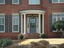 Turquoise dutch cottage door is good on a house with a gray color scheme. Best Front Door Colors Painted Door Ideas Hgtv