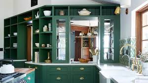 She painted her lower cabinets dark green, but replaced the upper cabinets with open shelving. Green Kitchens Are Having A Moment Architectural Digest