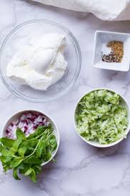 Basic raita ingredients tzatziki is part of greek cuisine and is most commonly eaten along with southeast europe and the middle east. Refreshing Indian Raita Recipe Yoghurt Cucumber Dip Ginger With Spice