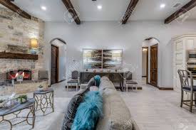 We added beams to the ceiling in our living room! The Great Room Has A Corner Fireplace Wood Look Tile And Wood Stock Photo Picture And Royalty Free Image Image 148433358