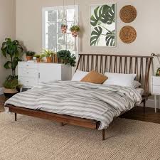 The arched shape of the headboard and footboard features straight spindles and curved accents. Queen Mid Century Modern Solid Wood Spindle Bed Walnut Saracina Home Bed Frame And Headboard Saracina Home Mid Century Modern Bedroom